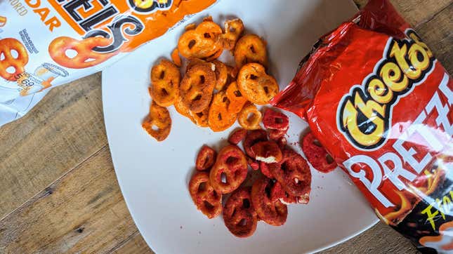 cheetos pretzels in Cheddar and Flamin' Hot flavors poured on a plate