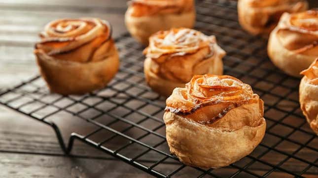 Apple pastry roses dessert on cooling rack