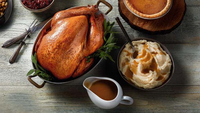 Boston Market mashed potatoes and gravy beside precooked turkey