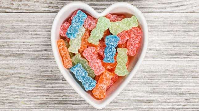 Sour Patch Kids sour candy in heart-shaped bowl